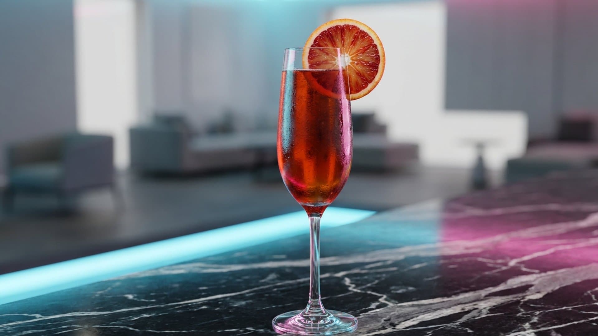 Soleil Rouge cocktail in a champagne flute garnished with blood orange wheel on rim